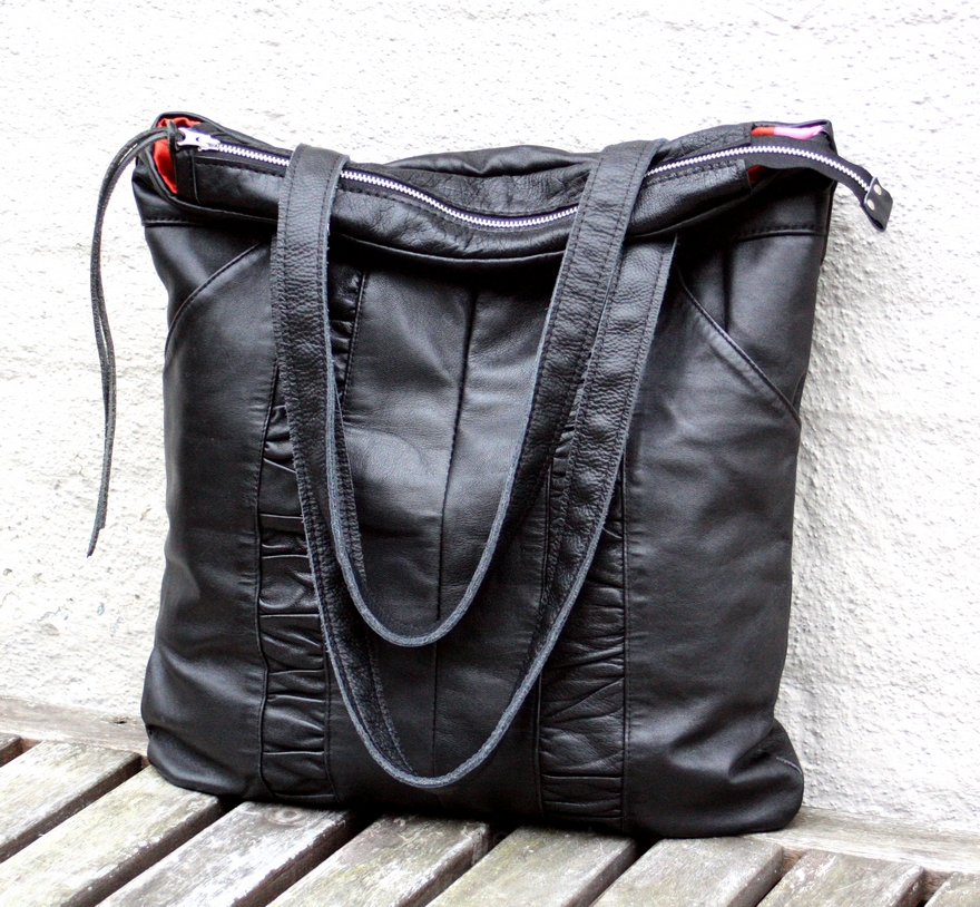 Black city bag made out of a pair of leather trousers. – byBessert