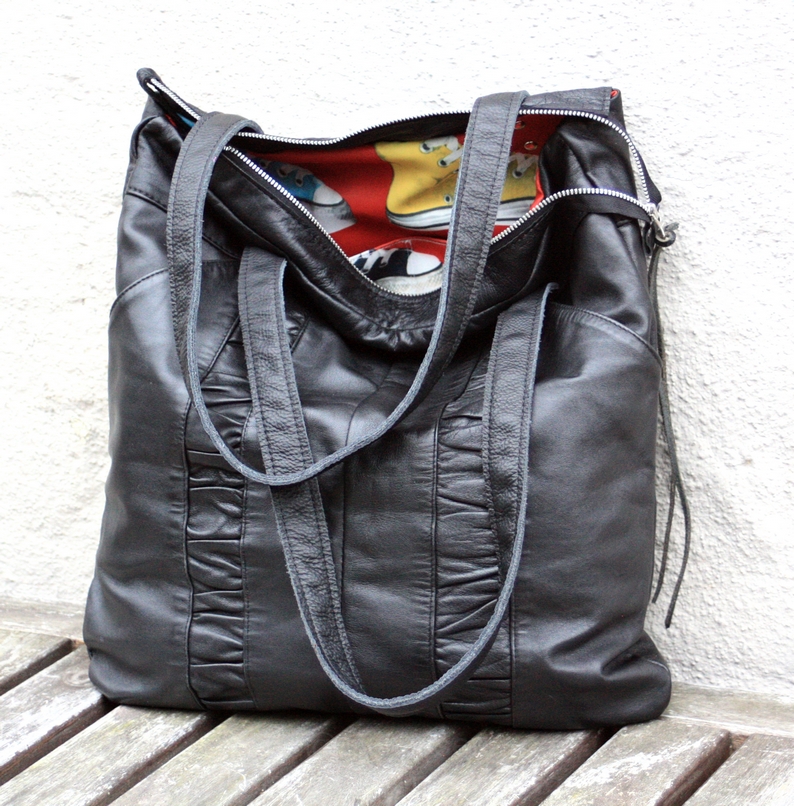 Black city bag made out of a pair of leather trousers. – byBessert